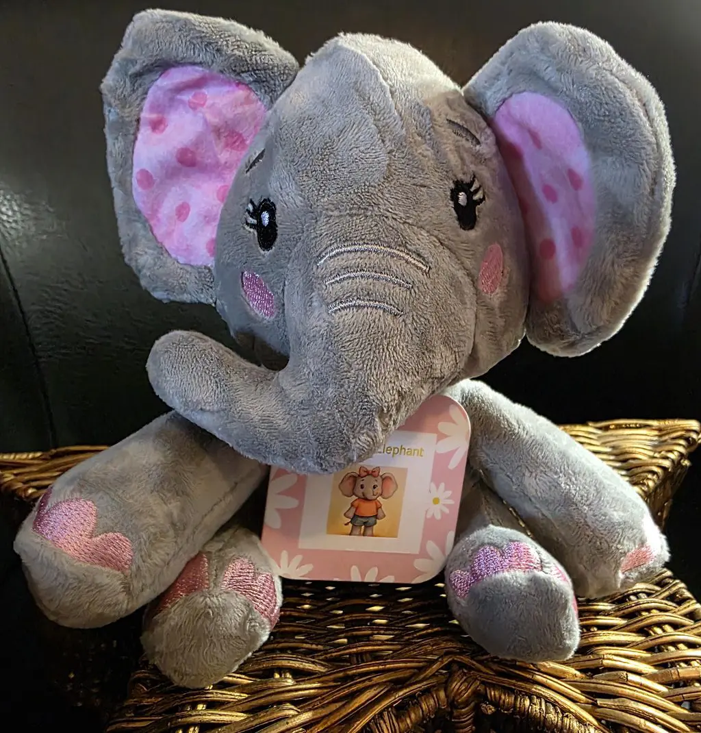 Plush elephant toy with pink accents.